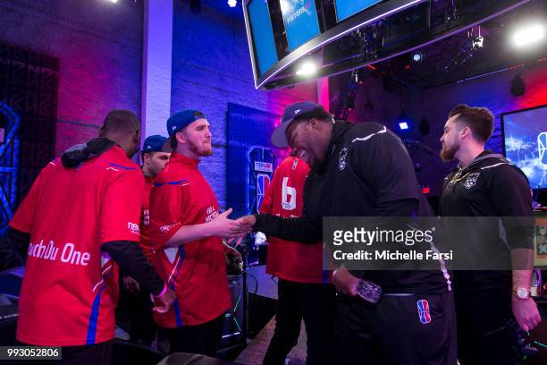 Lets Get It Ramo of Pistons Gaming Team shakes hands with worthingcolt of Kings Guard Gaming after the game on July 6, 2018 at the NBA 2K League...