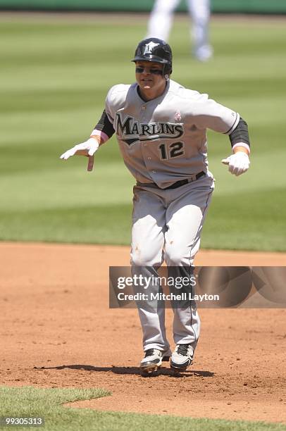 Cody Ross of the Florida Marlins leads off first base during a baseball game against the Washington Nationals on May 9, 2010 at Nationals Park in...