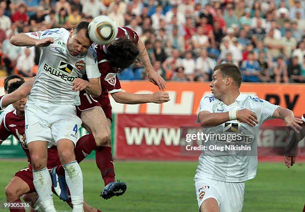 Fatih Tekke of FC Rubin Kazan battles for the ball with Sergei Ignashevich and Aleksei Berezutski of PFC CSKA Moscow in action during the Russian...