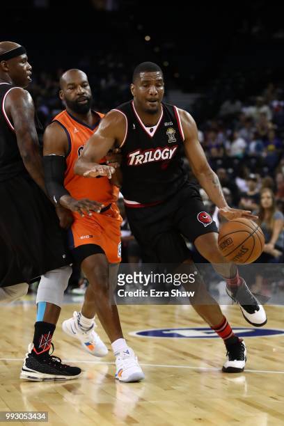 James White of Trilogy drives past Baron Davis of 3's Company during week three of the BIG3 three on three basketball league game at ORACLE Arena on...