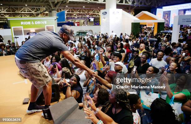 Singer NE-YO greats the crowd during the SiriusXM's Heart & Soul Channel Broadcasts from Essence Festival on July 6, 2018 in New Orleans, Louisiana.