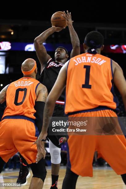 Al Harrington of Trilogy shoots over Drew Gooden and DerMarr Johnson of 3's Company during week three of the BIG3 three on three basketball league...