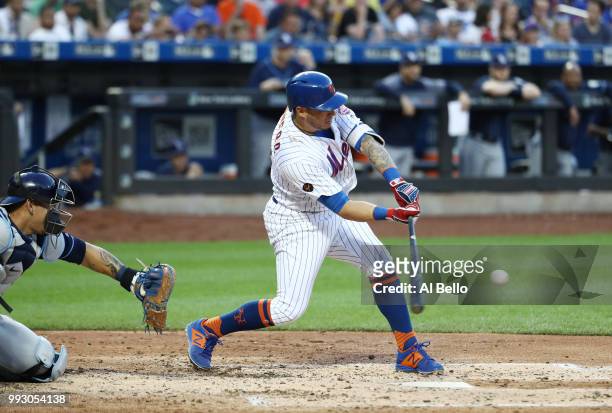 Asdrubal Cabrera of the New York Mets drives in a run with a single in the third inning against the Tampa Bay Rays during their game at Citi Field on...