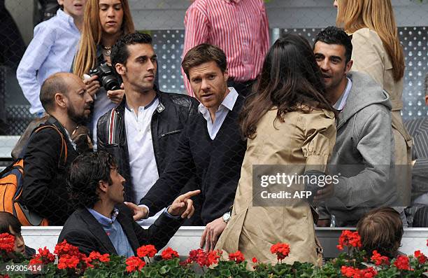 Real Madrid's football players Raul Gonzalez, Alvaro Arbeloa, Xabi Alonso and Raul Albiol attend the game between Spain's Rafael Nadal and France's...
