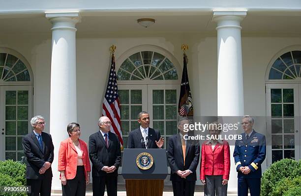 President Barack Obama speaks flanked by members of his administration, including Secretary of Homeland Security Janet Napolitano , Interior...