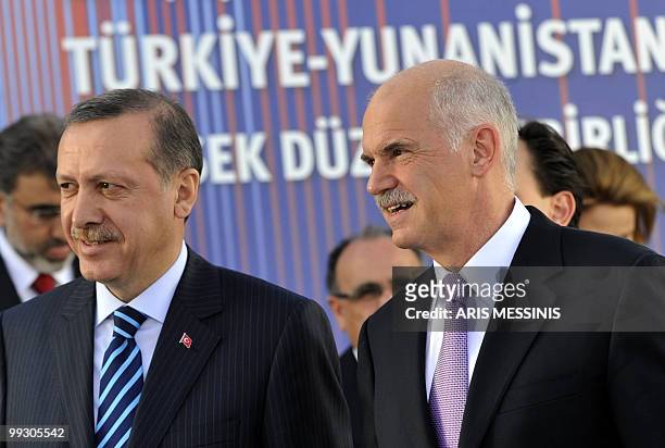 Greek Prime Minister George Papandreou, and his Turkish counterpart Recep Tayyip Erdogan speak after signing an agreement in Athens on May 14, 2010....