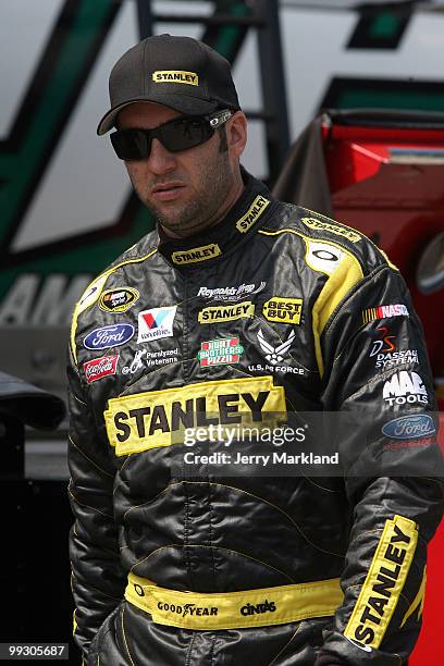 Elliott Sadler, driver of the Stanley Ford, walks in the garage area during practice for the NASCAR Sprint Cup Series Autism Speaks 400 at Dover...