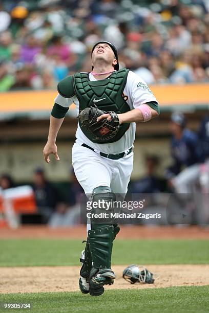Landon Powell of the Oakland Athletics chasing a popup during the game against the Tampa Bay Rays at the Oakland Coliseum on May 9, 2010 in Oakland,...