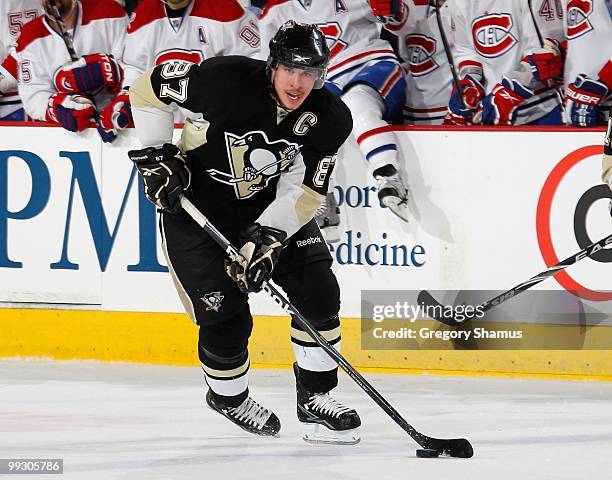 Sidney Crosby of the Pittsburgh Penguins moves the puck against the Montreal Canadiens in Game Seven of the Eastern Conference Semifinals during the...