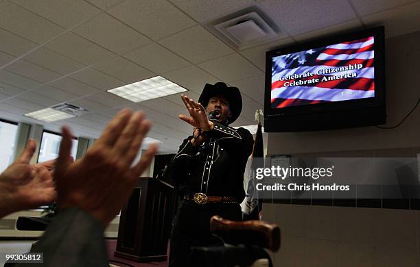 Country music singer J.W. Lance entertains the crowd from over fifty nations with American-style music before a naturalization ceremony at a U.S....