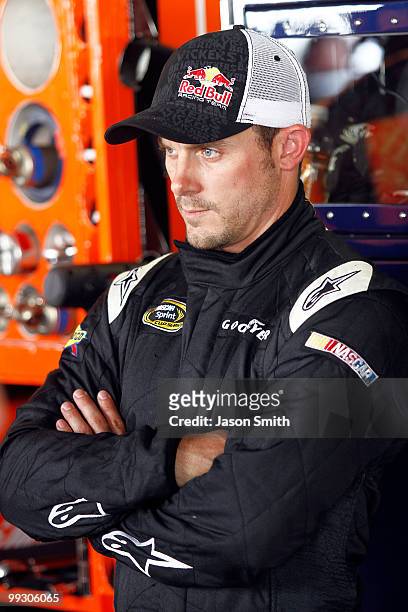 Casey Mears, driver of the Red Bull Toyota, stands in the garage during practice for the NASCAR Sprint Cup Series Autism Speaks 400 at Dover...