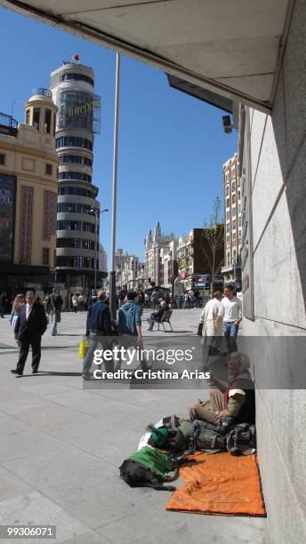 Beggar in the Plaza del Callao next to Gran Via Street, Madrid, Spain, april 2010 .