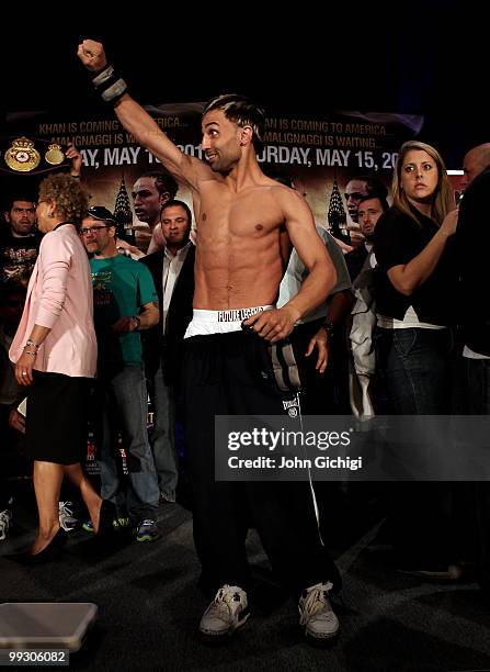 Paulie Malignaggi taunts Amir's fans before fighting broke out at the weigh in for his WBA light welterweight title fight against Amir Khan on May...