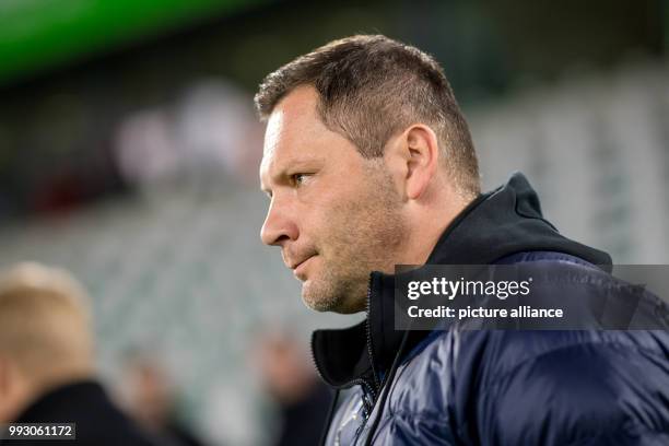 Hertha's trainer Pal Dardai observes the game concentrated during the Bundesliga soccer match between VfL Wolfsburg vs Hertha BSC in the Volkswagen...