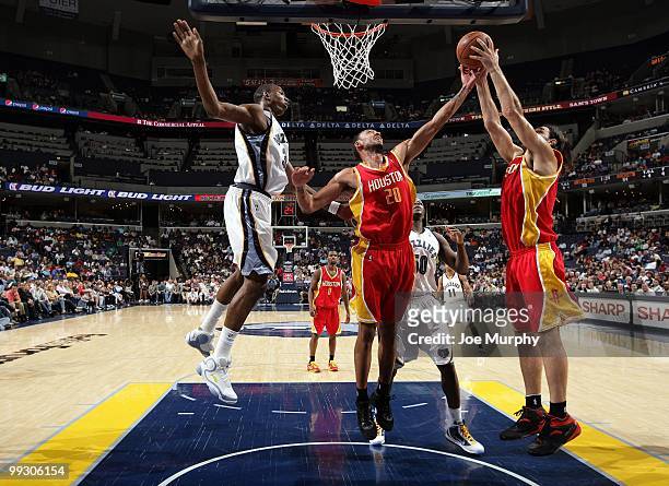 Jared Jeffries and Luis Scola of the Houston Rockets makes a rebound against Hasheem Thabeet of the Memphis Grizzlies during the game at the...