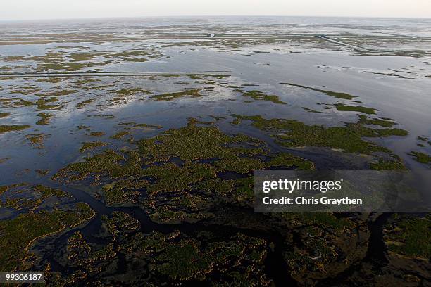 The sun sets on the grassy wetlands near the Louisiana coast line of Saint Bernard Parish on April 28, 2010.