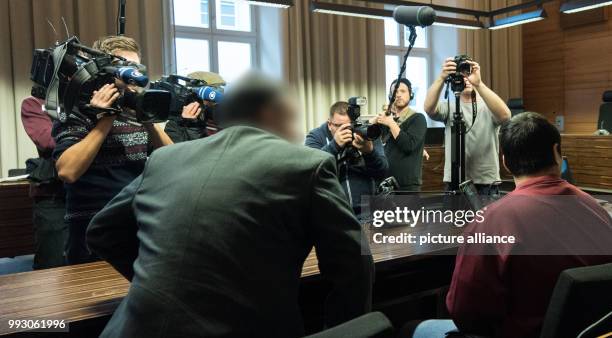 The accused, Hussein K. , sitting next to his interpreter in a courtroom of the District Court in Freiburg, Germany, 07 November 2017. The murder...