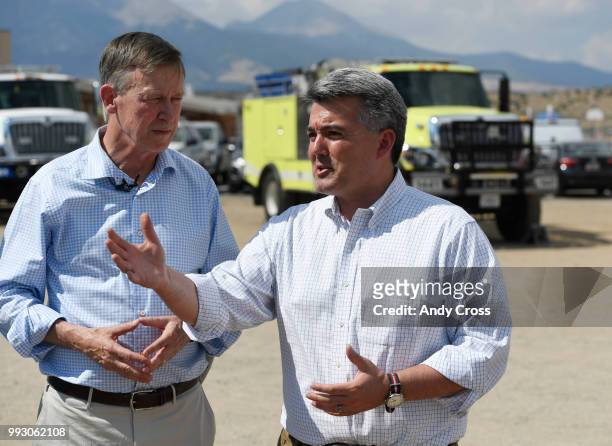 Senator Cory Gardner, right, along with Colorado Governor John Hickenlooper discuss the Spring Fire during a press conference at the Sierra Grande...