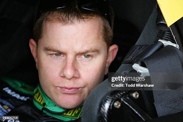 Jason Leffler, driver of the ABF Freight Toyota, sits in his car during practice for the NASCAR Nationwide Series Heluva Good 200 at Dover...