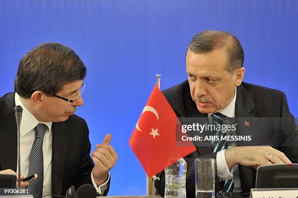Turkish Prime Minister Recep Tayyip Erdogan speaks with his Foreign Minister Ahmet Davutoglu in Athens on May 14, 2010. Turkey's Prime Minister Recep...