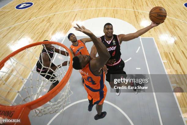 James White of Trilogy goes up for a shot against Jason Maxiell of 3's Company during week three of the BIG3 three on three basketball league game at...