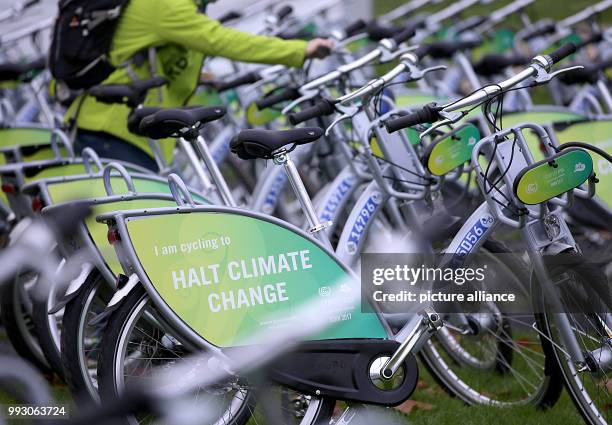 Rental bicycles with the text "Stop climate change" available for participants in the World Climate Conference to move between meeting places in...