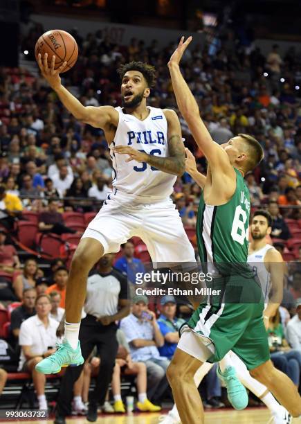 Jonah Bolden of the Philadelphia 76ers drives to the basket against Jarrod Uthoff of the Boston Celtics during the 2018 NBA Summer League at the...