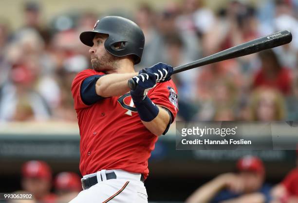 Brian Dozier of the Minnesota Twins hits an RBI single against the Baltimore Orioles during the first inning of the game on July 6, 2018 at Target...
