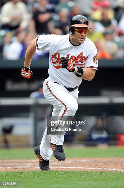 Luke Scott of the Baltimore Orioles runs the bases after hitting a grand slam home run in the eighth inning against the Seattle Mariners at Camden...