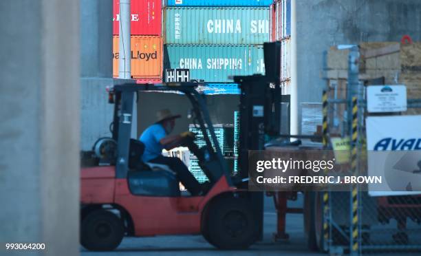 Containers are stacked at the Port of Long Beach in Long Beach, California on July 6 including some from China Shipping, a conglomerate under the...