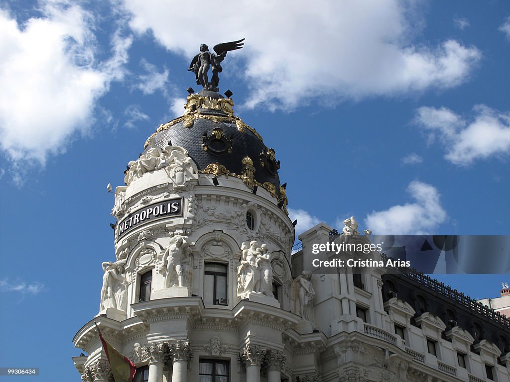 Metropolis Building (1907-1910) crowned with a winged statue simbolising victory, Gran Via Street, Madrid.