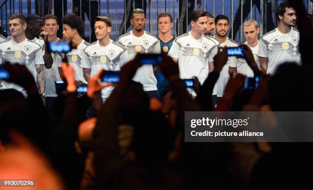 The players of the German men's soccer national team present the new jersey of the national team for the FIFA World Cup 2018 in Russia during a...