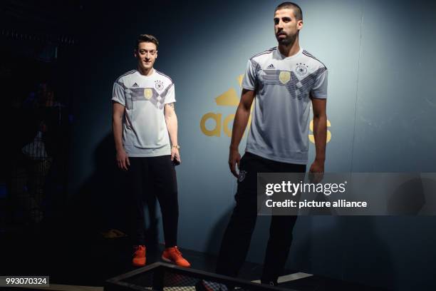 Mesut Oezil and Sami Khedira of the German men's soccer national team present the new jersey of the national team for the FIFA World Cup 2018 in...