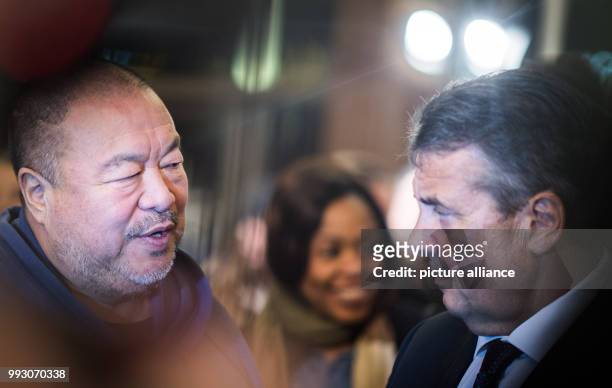 Chinese artist Ai Weiwei and German Minister of Foreign Affairs Sigmar Gabriel arrive at the Germany premiere of Ai Weiwei's movie 'Human Flow' in...