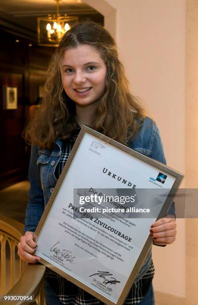 Student Emilia S. From Dresden, photographed with her award document after an interview at a hotel in Berlin, Germany, 7 November 2017. The...