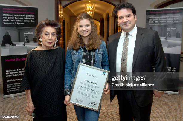 Student Emilia S. From Dresden, photographed with her award document after an interview at a hotel in Berlin, Germany, 7 November 2017. She received...