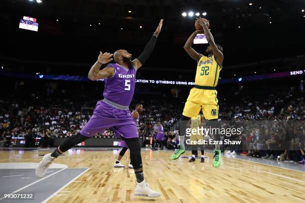 DeShawn Stevenson of Ball Hogs takes a shot as Carlos Boozer of Ghost Ballers defends during week three of the BIG3 three on three basketball league...
