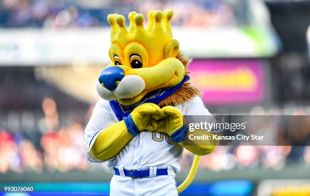 Kansas City Royals mascot Sluggerrr mimics shortstop Alcides Escobar during introductions before a game against the Boston Red Sox on Friday, July 6...
