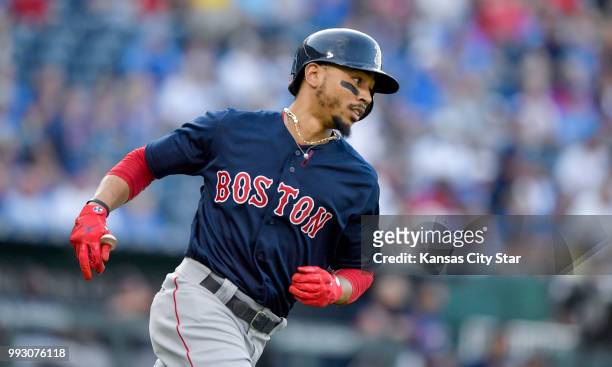 The Boston Red Sox's Mookie Betts rounds the bases after a leadoff solo home run in the first inning against the Kansas City Royals on Friday, July 6...