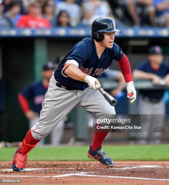 The Boston Red Sox's Brock Holt follows through on a two-run single in the first inning against the Kansas City Royals on Friday, July 6 at Kauffman...