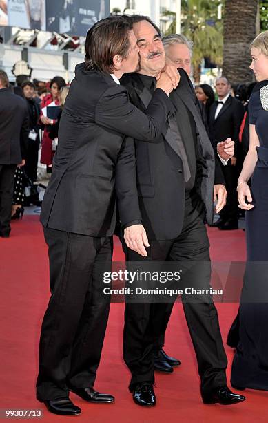 Actor Josh Brolin kisses director Oliver Stone attend the Premiere of 'Wall Street: Money Never Sleeps' held at the Palais des Festivals during the...