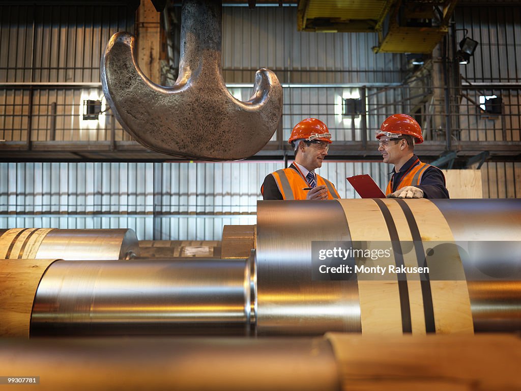 Engineers Inspecting Steel Rollers