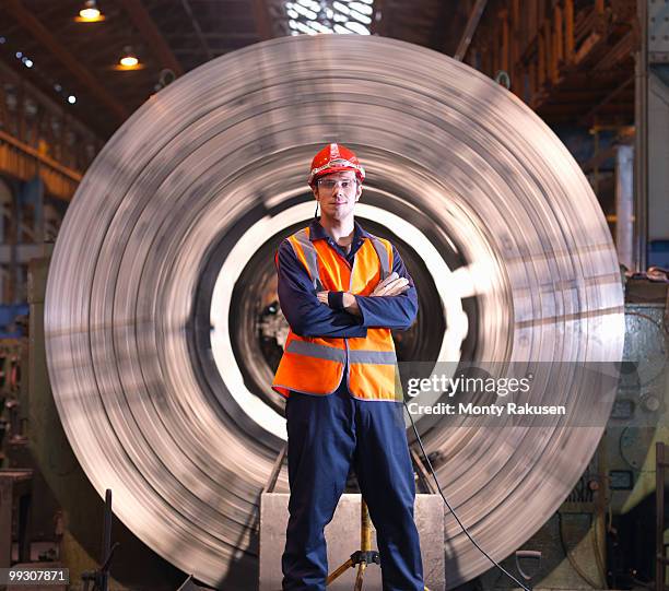 engineer in front of steel lathe - monty rakusen portrait stock pictures, royalty-free photos & images