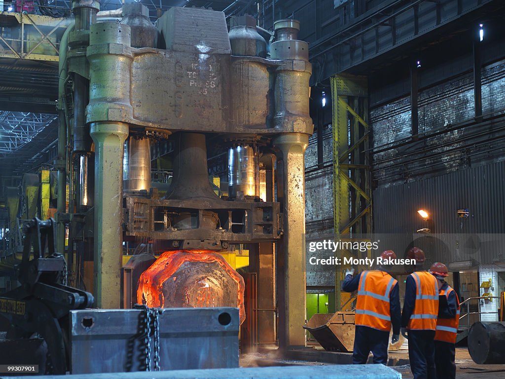 Engineers & Hot Steel In Forging Machine