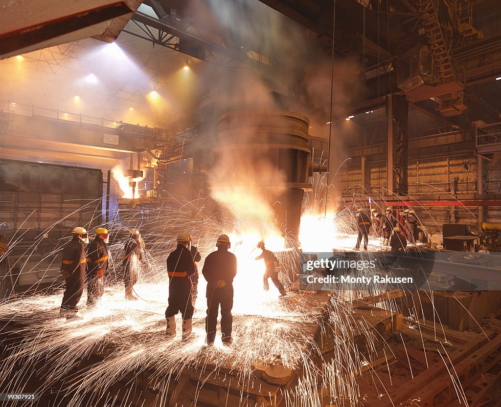 Workers With Molten Steel In Plant