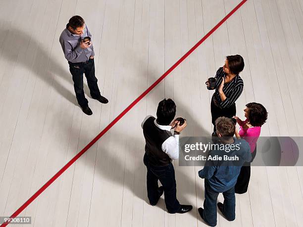 business men and women by red line - ausschluss stock-fotos und bilder