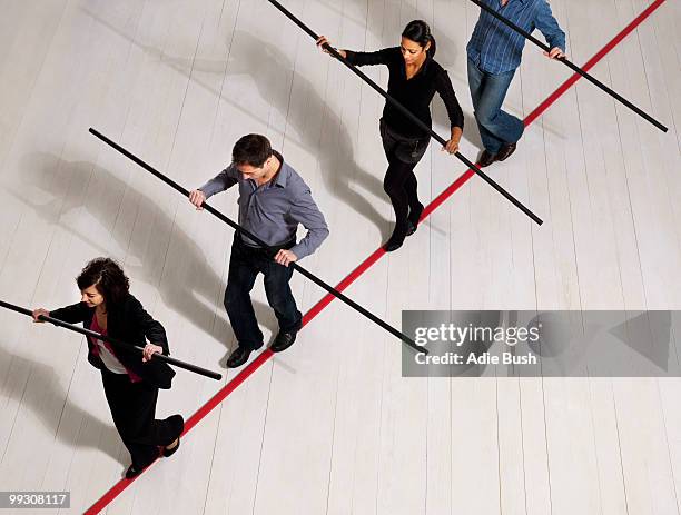 people balancing on thin red line - woman tightrope stock pictures, royalty-free photos & images