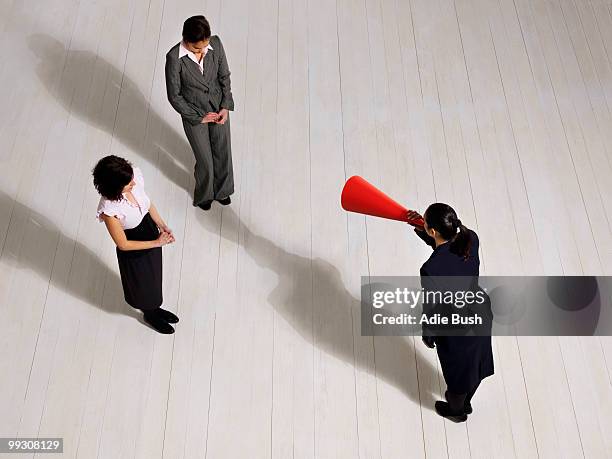 business woman shouting at women - harassment work stock pictures, royalty-free photos & images
