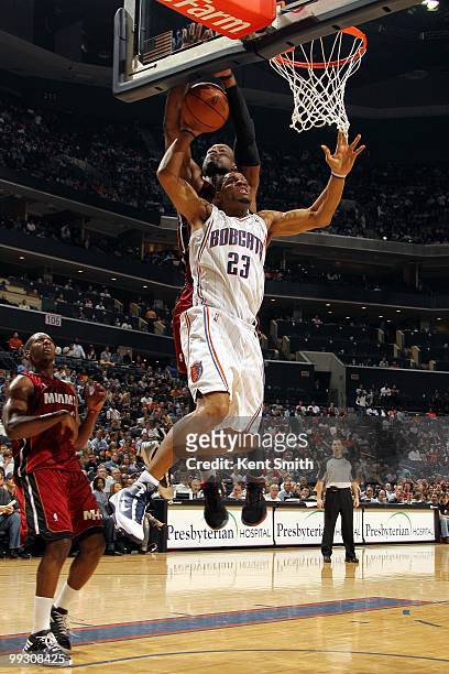 Stephen Graham of the Charlotte Bobcats gets blocked by Dwyane Wade of the Miami Heat during the game at Time Warner Cable Arena on March 9, 2010 in...