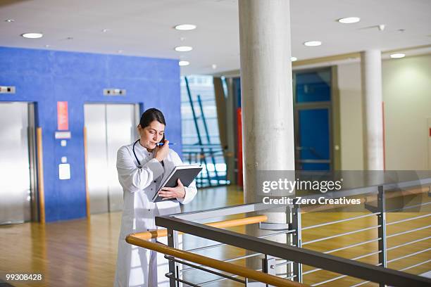 female doctor - busy hospital lobby stock pictures, royalty-free photos & images